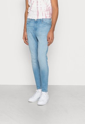 Jeans Tapered Fit - light-blue denim