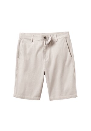 Beige cotton shorts with a button closure, two side pockets, and a flat front design. Soft texture, knee-length, and minimal stitching details.