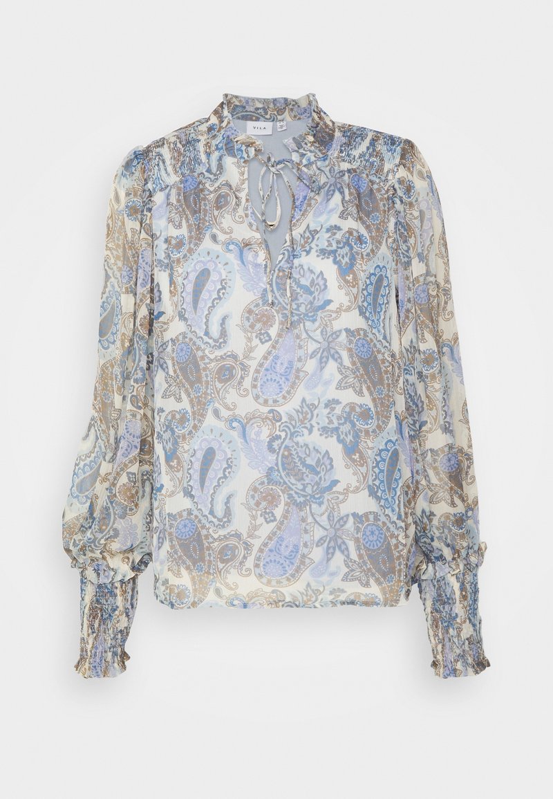 Blouse à manches longues à motif paisley floral, poignets froncés, col à nouer, aux couleurs douces bleu, beige et blanc sur tissu transparent.