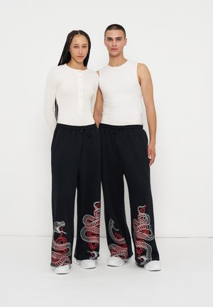 YOURTURN by Zalando, UNISEX - Долнище на анцуг - black