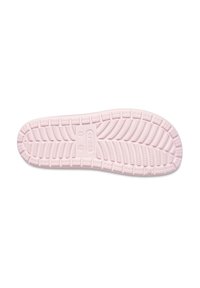 Pink rubber shoe sole with textured pattern for grip; features ridges, channels, and branding stamped in the center.