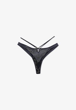 Black thong made of soft fabric with a sheer mesh panel and floral embroidery. Features thin straps and a minimalist design.