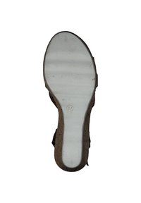 Shoe sole featuring a white rubber surface, contoured shape, and a cork accent on the edges. Number "37" debossed near the heel.