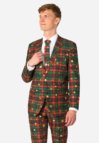 Rot-grün Karomuster-Anzug mit goldenen Sternen, Knopfverschluss und passender Krawatte. Verfügt über eine schmale Passform und ein weißes Dress-Shirt darunter.