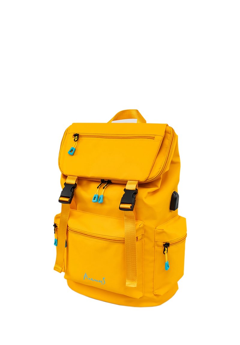 Yellow fabric backpack with a top flap, multiple zippered pockets, and blue zipper accents. Features adjustable straps and a sturdy handle.