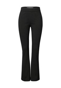Pantalons noirs évasés en tissu extensible. Taille haute, texture lisse, sans coutures visibles ni motifs supplémentaires.