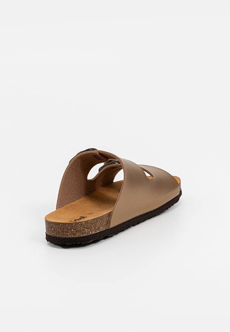 Sandale ouverte marron avec deux larges brides croisées, semelle en liège et semelle en caoutchouc noir. Texture en cuir lisse avec des détails découpés.
