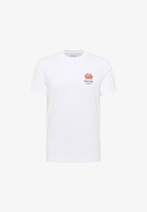 T-shirt en coton blanc avec un graphique de crabe en orange et noir sur le côté gauche de la poitrine. Design à col ras du cou classique et à manches courtes.