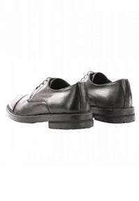 Scarpe eleganti in pelle nera con finitura liscia, punta tonda e design con lacci. Presentano una suola in gomma testurizzata per aderenza e durata.