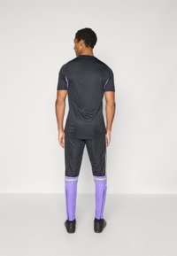 adidas Performance SQUADRA25 TRAINING PANT - Trainingsbroek - black/purple rush