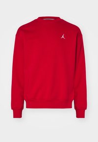 Red long-sleeve crewneck sweatshirt with small white Jumpman logo on the upper left chest and ribbed cuffs and hem.