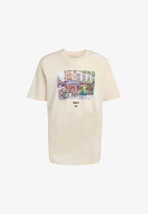 T-shirt crema a maniche corte con una grafica colorata di una scena di un caffè parigino e la parola "PARIS" sottostante in grassetto.