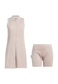 Vaaleanbeige hihaton mekko, jossa on vetoketjukiinnitys edessä ja kaulus, yhdistettynä istuviin lyhyisiin housuihin. Valmistettu sileästä, joustavasta kankaasta.