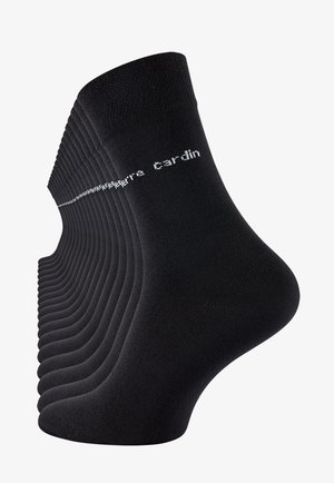 Black cotton socks with ribbed texture, featuring white logo text "Pierre Cardin" along the upper edge. Multiple pairs displayed in perspective.