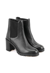 Bottines noires en cuir avec une finition texturée, panneaux latéraux élastiques, un talon bloc de 10 cm, et une semelle en caoutchouc avec des motifs de traction.