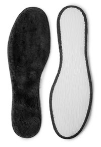 Black faux fur insole on one side, textured white rubber on the other, edged with black stitching. Smooth, contoured shape for foot support.