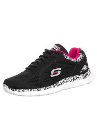 Black athletic shoes with mesh upper, pink accents, and a white textured sole featuring a black and white pattern along the sides.