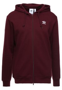 Sudadera de color burdeos con cremallera fabricada en mezcla de algodón, que cuenta con un bolsillo tipo canguro, dos cordones ajustables y un pequeño logotipo blanco en el pecho.