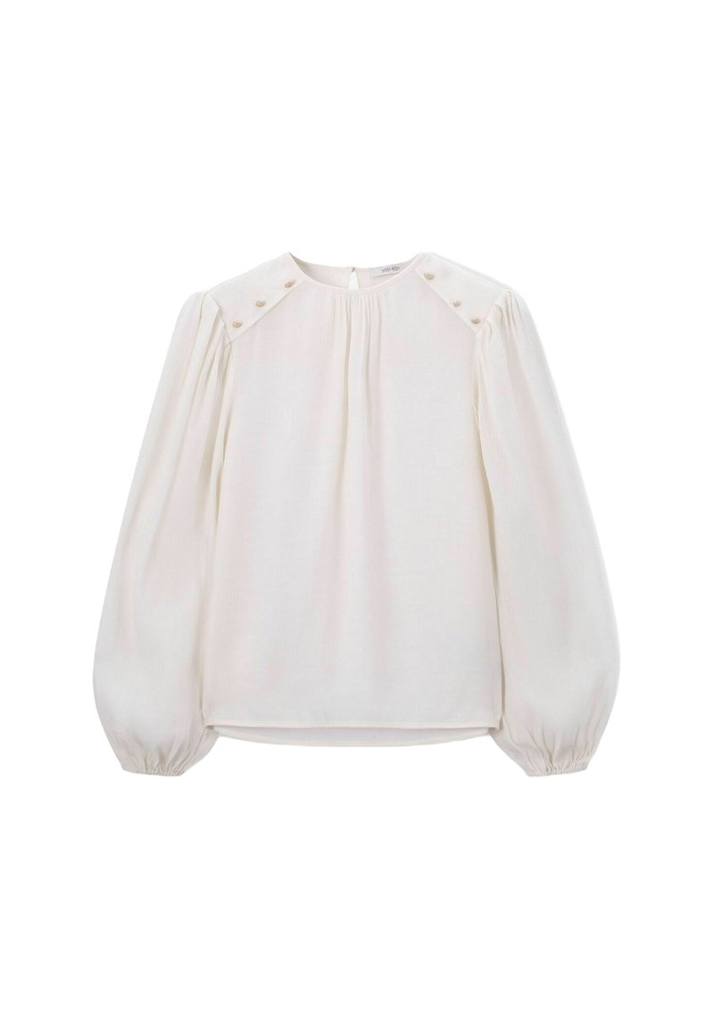 Weiße Bluse mit langen Puffärmel, gefaltetem Vorderteil, Knopfakzenten an den Schultern und Schlüsselaugenverschluss auf der Rückseite. Glatte, leichte Stoffqualität.