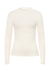 Top a maniche lunghe in maglia a coste color crema con una silhouette aderente e un collo e un orlo ondulati. Il tessuto elasticizzato offre una texture liscia.