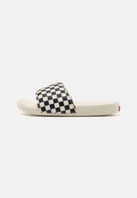 Black and white checkerboard slide sandal with a smooth, contoured sole. Features a wide strap and a red logo accent on the heel.