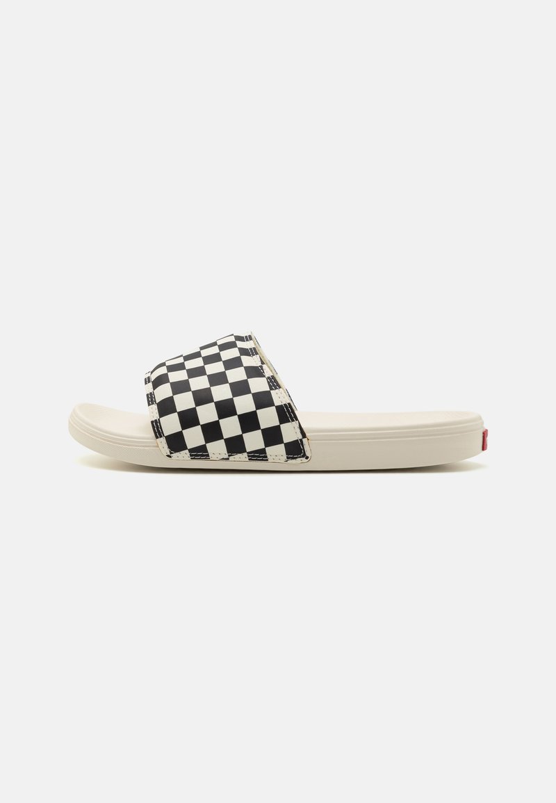 Black and white checkerboard slide sandal with a smooth, contoured sole. Features a wide strap and a red logo accent on the heel.