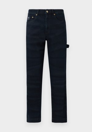 Mørkeblå rette jeans med frontlommer, beltehemper og en sideløkke-detalj på høyre bein.