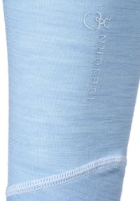 Ljusblå leggings i ullblandning med en mjuk textur, noggrant utförd sömnad och präglad logotyp på sidan.