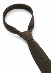 Brown herringbone tie with a textured pattern. Features a standard width and tapered end, loops around the neck in a knot.