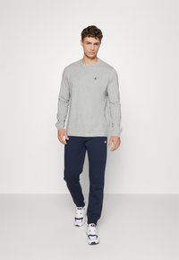 Champion BASIC CUFF PANTS - Tréningruha alsók - dark blue