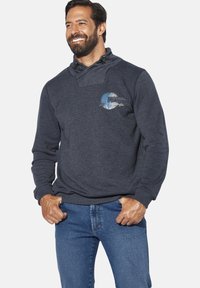 Dark gray sweatshirt with funnel neck, drawstrings, and a chest graphic featuring blue and white patterns. Made from a soft fabric.