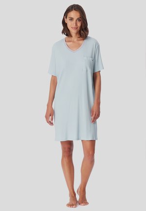 Light blue short-sleeve nightdress with a V-neck, pocket detail on the left chest, and a soft ribbed texture. Mid-thigh length.