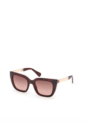 Quadratische Schildpatt-Sonnenbrille mit braunen Verlaufsgläsern und dünnen, goldfarbenen Metallbügeln.