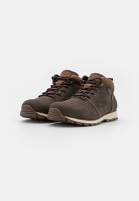 Brown hiking boots featuring a textured leather upper, contrasting brown accents, lace-up front, and durable rubber tread sole.