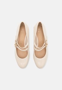 Marco Tozzi Baleríny s páskem - cream