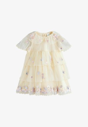 Krém réteges tüll kislány ruha rövid pufi ujjakkal, csipkés szegéllyel és pasztell virágos hímzéssel flitterekkel.