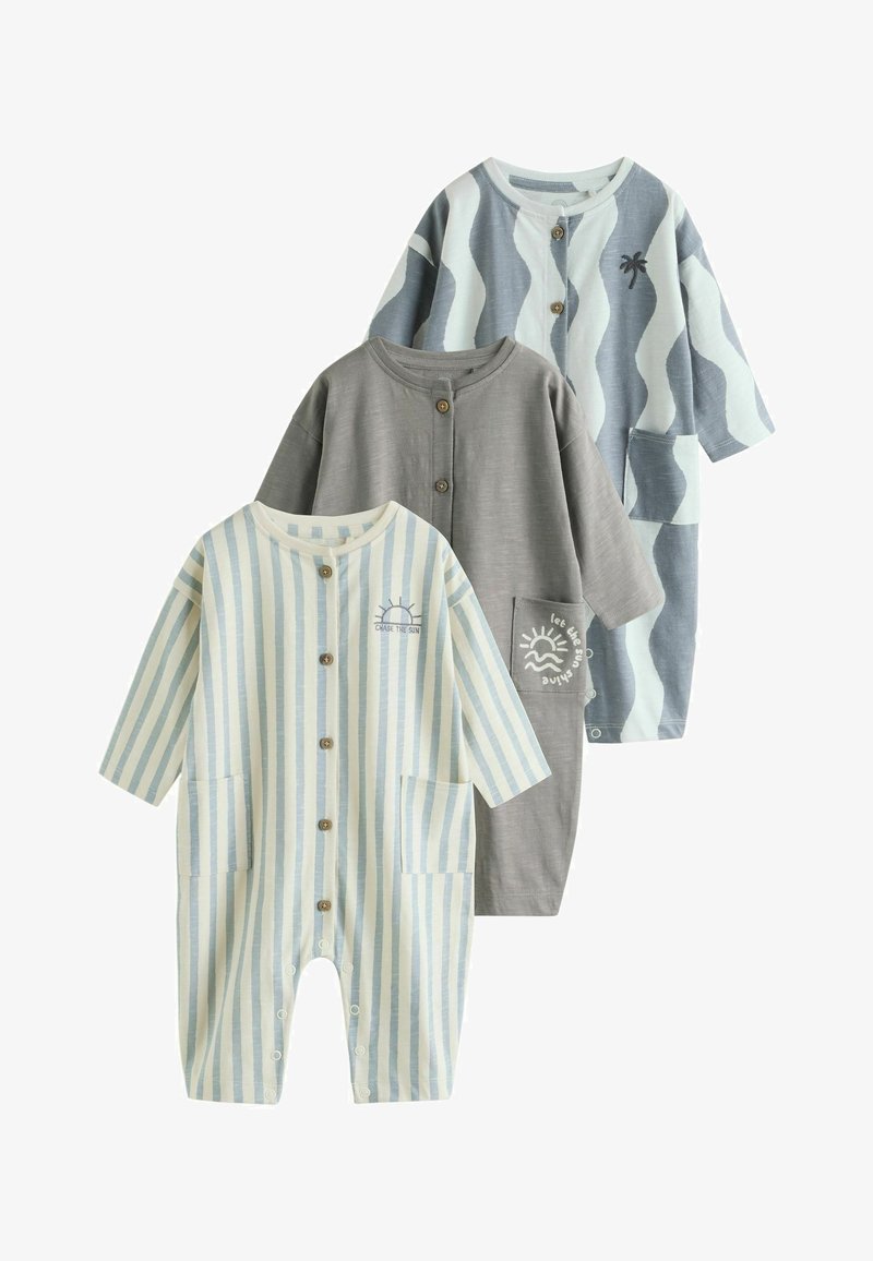 Trois combinaisons pour enfants en coton doux. Elles présentent des rayures pastel, un motif de vagues et des motifs solaires décoratifs. Boutons et poches inclus.