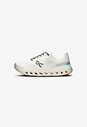 White running shoe with a mesh upper, black and turquoise laces, and a distinctive midsole featuring cutouts for cushioning and support.