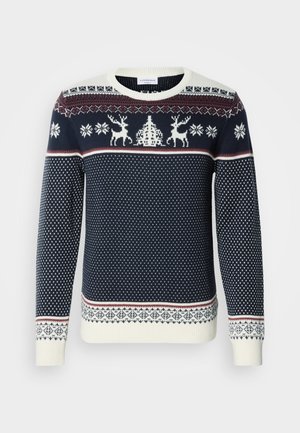 Suéter de punto azul marino con renos blancos y copos de nieve. Cuello, puños y dobladillo acanalados; presenta bandas alternadas con patrones.