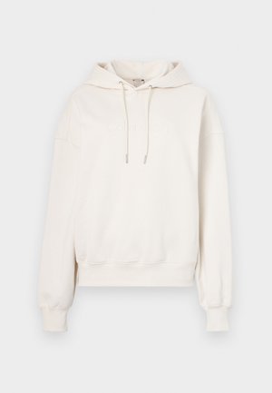 Kremowa bluza z kapturem z wiązaniem, ściągaczami u rękawów i wytłoczonym logo z przodu. Wykonana z miękkiego materiału o luźnym kroju.