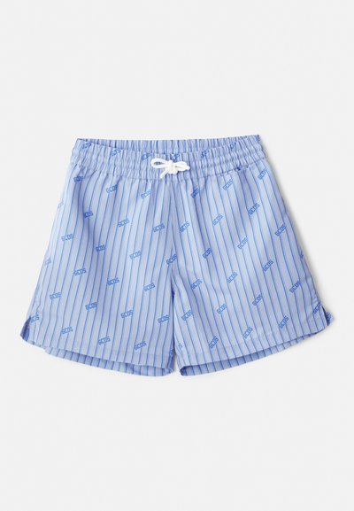 Light blue swim trunks with vertical white stripes and small blue logos. Features an elastic waistband with a white drawstring and side slits.