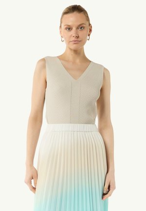 Beige sleeveless top with ribbed texture and V-neck, paired with a pleated skirt transitioning from off-white to light blue.
