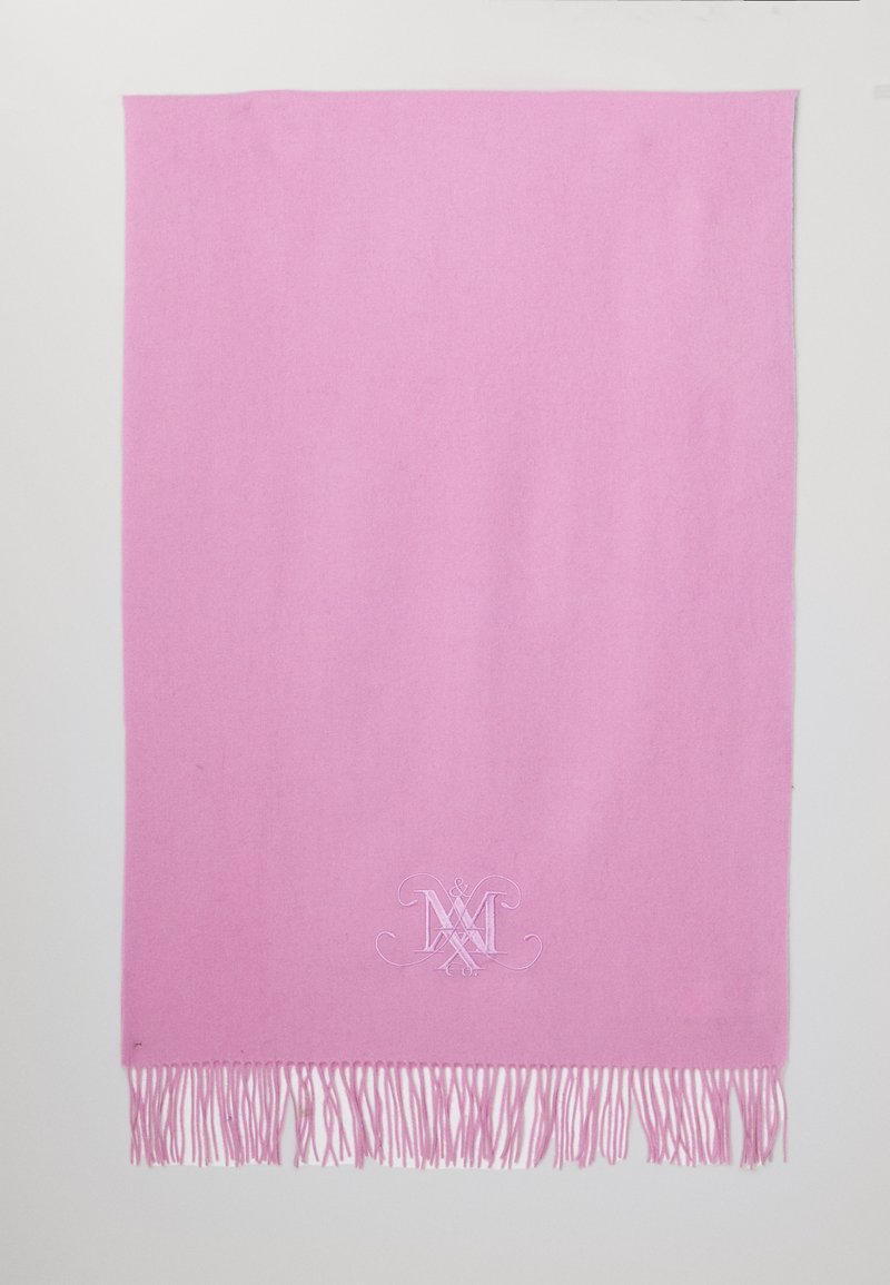 Pink wool scarf with fringe edges, featuring an embroidered monogram design at the bottom center. Soft texture and rectangular shape.