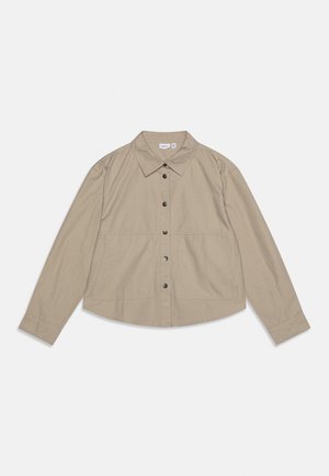 Beige long-sleeve shirt jacket with spread collar, snap button front closure, and two front pockets on a white background.