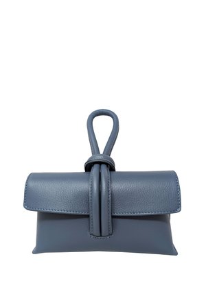 Small blue leather handbag with flap closure and looped strap detail on a white background.