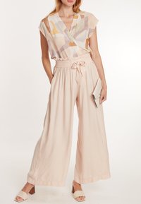 Cache Coeur PREGNANCY SAHEL - Stoffhose - sand