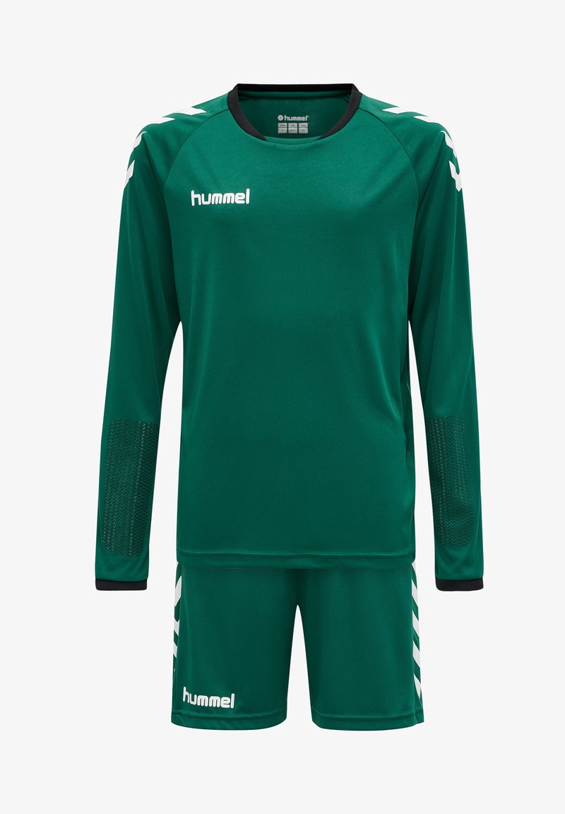 Grøn sportsdragt med langærmet top og shorts. Fremstillet af fugttransporterende stof, har mesh-paneler på ærmerne og hvide detaljer.