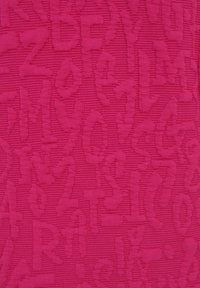 Textured fabric in vibrant pink featuring an embossed pattern of letters and numbers, creating a playful relief effect across the surface.