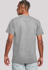 Gray cotton t-shirt with short sleeves, a crew neck, and a plain back design. Features a relaxed fit and soft texture.