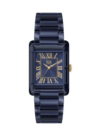 Pravokutni tamnoplavi sat s prozirnim remenom, zlatnim rimskim brojkama, zlatnim kazaljkama i logotipom "ice watch" na brojčaniku.
